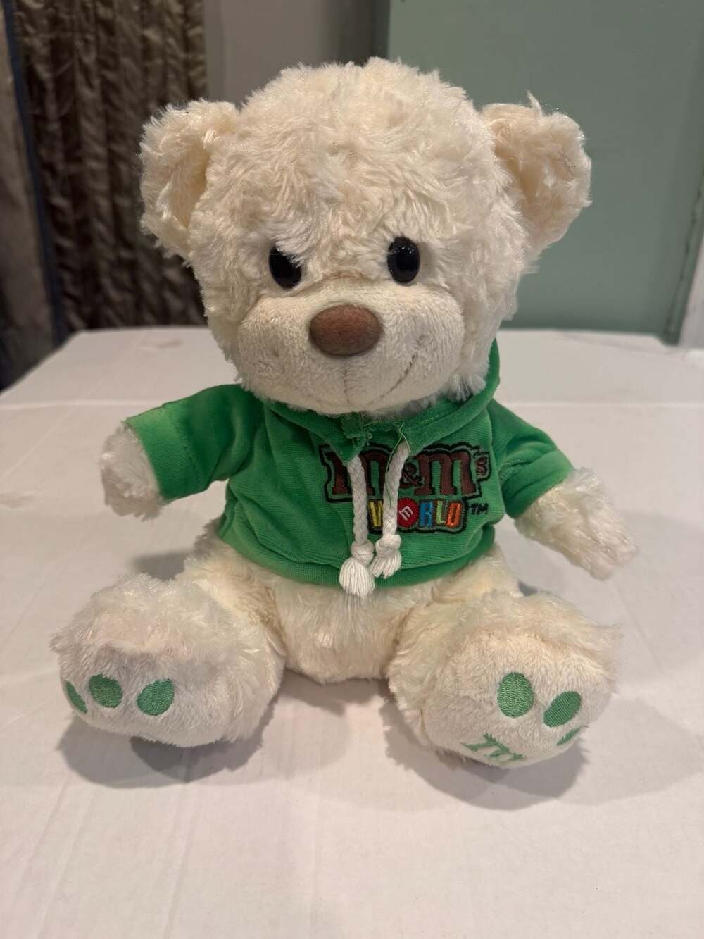 M&M's World Cream Teddy Bear in Green Hoodie